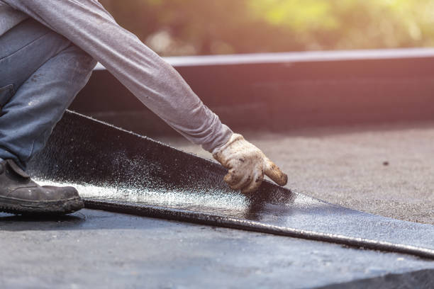 Professional Basement Waterproofing technician working in Chase, PA